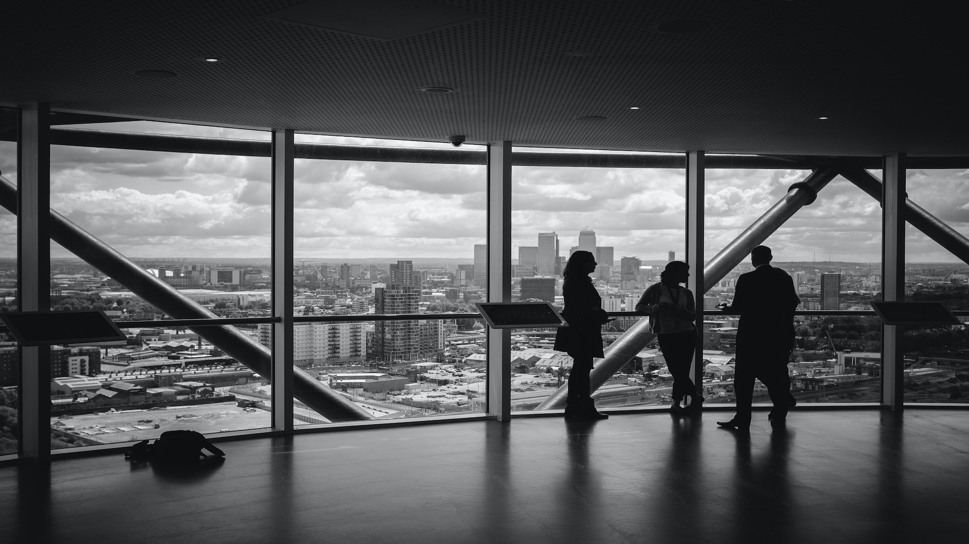 business people silhouette image of the city