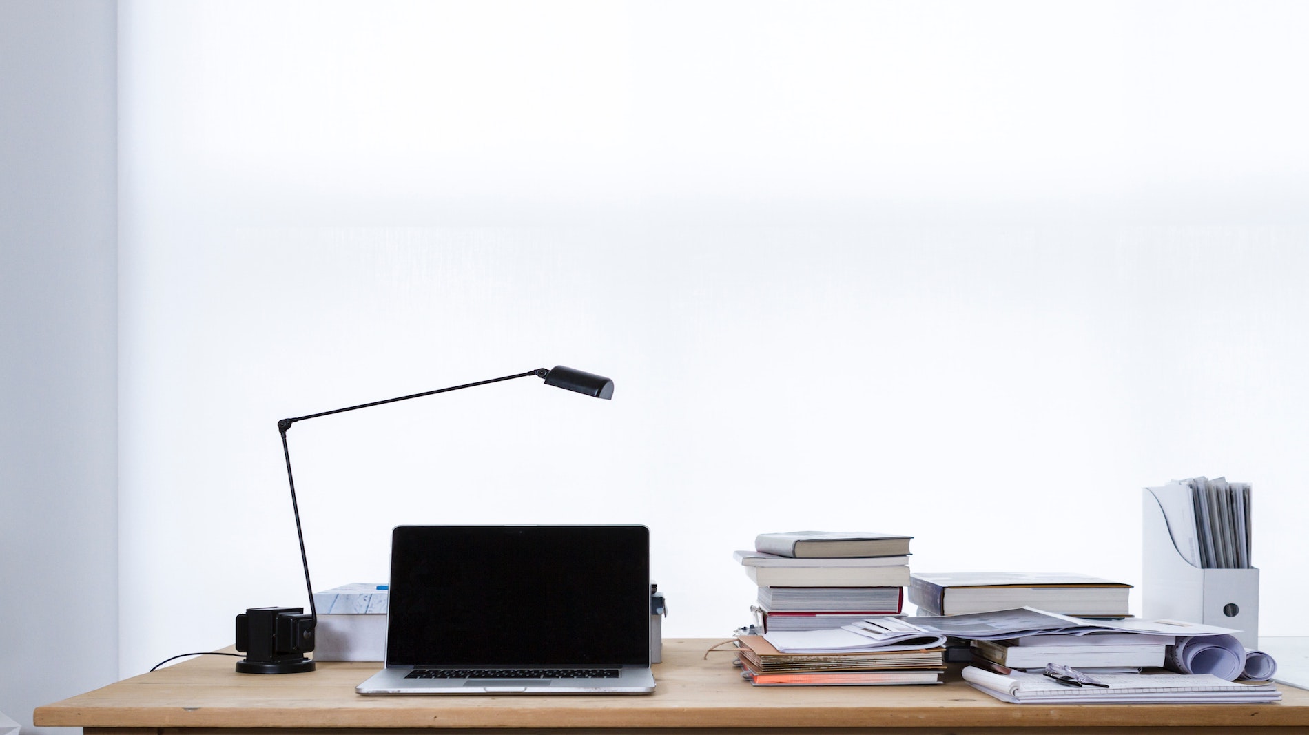 laptops and books on a study table for representation